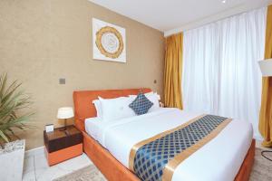 Postel nebo postele na pokoji v ubytování Bel Air Crest Hotel & Suites