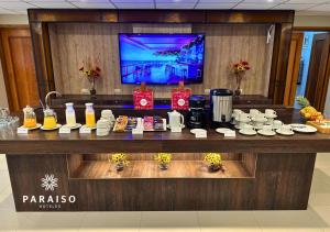 a bar in a hotel room with a counter with coffee and drinks at Hoteles Paraiso PIURA in Piura