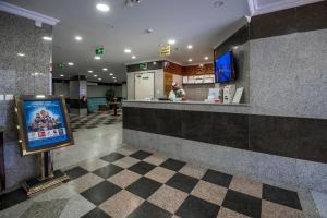 a restaurant lobby with a counter and a cash register at انوار احد in Al Madinah