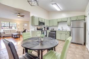 a kitchen and dining room with a table and chairs at Charming Hinesville Home Less Than 6 Mi to Fort Stewart in Hinesville
