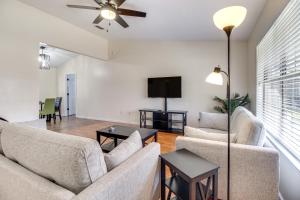 a living room with two couches and a flat screen tv at Charming Hinesville Home Less Than 6 Mi to Fort Stewart in Hinesville