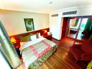 Voodi või voodid majutusasutuse King Suites Hotel toas