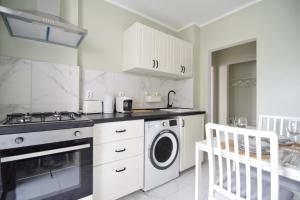 Η κουζίνα ή μικρή κουζίνα στο Stylish Apartment with video projector