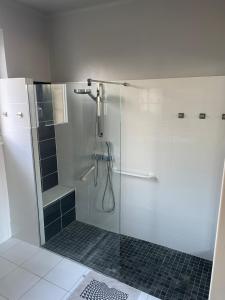 a bathroom with a shower with a glass door at Villa de caractère à Saint- Malo 100m du Sillon in Saint Malo
