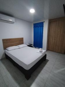 Voodi või voodid majutusasutuse Hotel Real del Valle toas