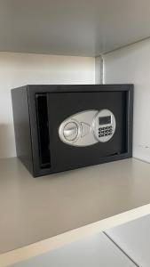 a microwave oven on a wall in a kitchen at Brest and Breakfast vue mer in Brest