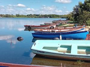 a group of boats sitting in the water at Cuan na bPiobairí in Mullingar