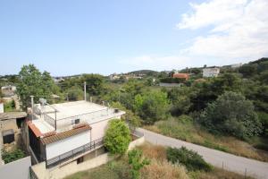 an aerial view of a building with a road at Filoxenia apartment in Artemida