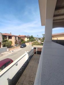 a view of a street from the balcony of a house at Villa Bianca BB e Apartments in Àrbatax