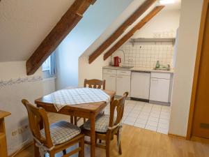 a kitchen and dining room with a table and chairs at Oberamer Hof in Bad Saulgau