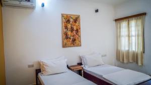 Postel nebo postele na pokoji v ubytování Nungwi House