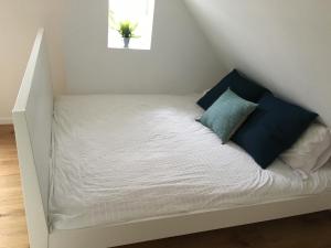 a bed in the corner of a room at Loft Apartment in Central Zug in Zug
