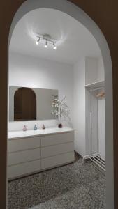 a bathroom with a sink and a mirror at Apartamento VILLASOLETE in Fuengirola