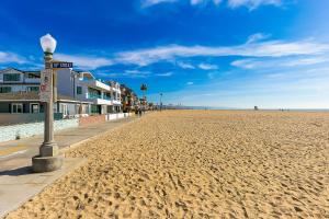 a sandy beach with a street light on it at Balboa Beauty III in Newport Beach