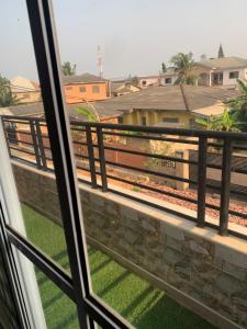 a view from a window of a train track at Eric’s Apartment in Kasoa