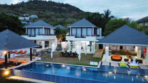 an aerial view of a house with a swimming pool at Bluemango Pool Villa & Resort Koh Samui in Koh Samui