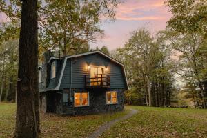 a small house in the middle of a forest at Rivers Ledge - 62 Acre Nature Retreat in Eldred
