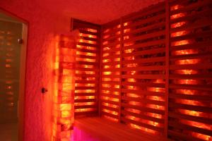 a wine cellar with a wall of wine bottles at Holiday Beach Budapest Wellness Hotel with Sauna Park in Budapest