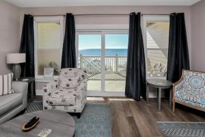 a living room with a view of the ocean at Pelican's Perch by Pristine Properties Vacation Rentals in Saint Joe Beach +76 photos