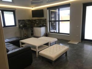 a living room with a couch and a table at Royal Relax in Khorodelets +11 photos