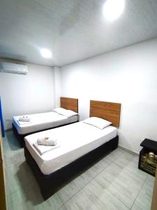 Voodi või voodid majutusasutuse Hotel Real del Valle toas