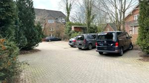 two cars parked on the side of a street at Studio Apartment - nahe Itzehoe in Itzehoe