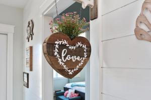 a heart sign hanging on a door in a room at Havin A Blas by Pristine Properties Vacation Rentals in Cape San Blas