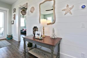 a room with a table and a mirror at Havin A Blas by Pristine Properties Vacation Rentals in Cape San Blas