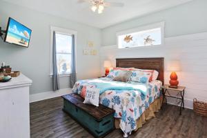 a bedroom with a bed and a window at Havin A Blas by Pristine Properties Vacation Rentals in Cape San Blas