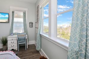 a childs room with a window with a view of the ocean at Havin A Blas by Pristine Properties Vacation Rentals in Cape San Blas