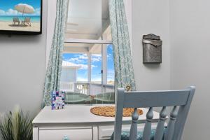 a room with a crib with a view of the beach at Havin A Blas by Pristine Properties Vacation Rentals in Cape San Blas