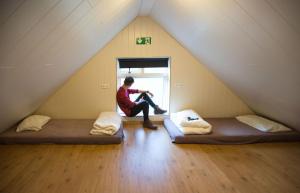 Ein Bett oder Betten in einem Zimmer der Unterkunft Vík Hostel