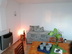 a room with a bed and a table with cups on it at La Rosa dei Venti in Colorado River