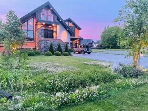 a house with a truck parked in front of it at Contemporary 2 Queens Room Near Horseshoe Fall in Niagara Falls