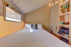 a bedroom with a large bed in a room at Tent#1-Luxury Camping Tent in Hill Country, Texas in Johnson City