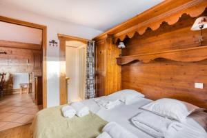 Łóżko lub łóżka w pokoju w obiekcie Résidence Les Alpages de Chantel - maeva Home - Appartement 4 Pièces 8 Personnes - Sélection MAE-1649