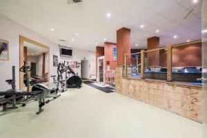 a fitness room with a gym with tread machines at Résidence Les Temples du Soleil - maeva Home - Studio 4 Personnes Confort 43 in Val Thorens