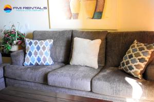 a couch with pillows on it in a living room at Marina Pinacate C-518 in Puerto Peñasco