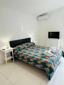 Ένα ή περισσότερα κρεβάτια σε δωμάτιο στο THE HOUSE FIERA di ROMA AEROPORTO FIUMICINO