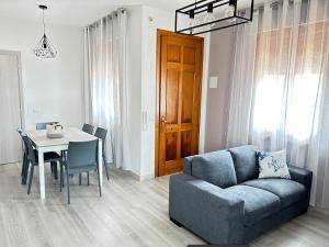 a living room with a couch and a table at Venice Queen Apartments in Cavallino-Treporti