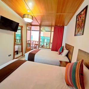Postel nebo postele na pokoji v ubytování Inti Pacha Palace Machupicchu