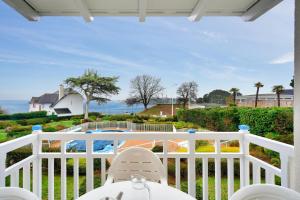 a white porch with a view of the ocean at Le Cap Glénan - maeva Home - 2 Pièces 5 Personnes Confort MAE-5638 in Bénodet