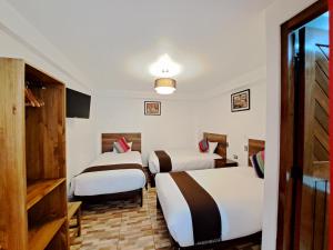 Postel nebo postele na pokoji v ubytování Inti Pacha Palace Machupicchu