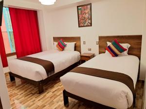 Postel nebo postele na pokoji v ubytování Inti Pacha Palace Machupicchu
