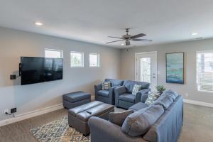 a living room with a couch and a flat screen tv at 18th Fairway to Heaven in St. George
