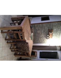 a kitchen with wooden cabinets and a microwave at R&eacute;sidence Le Galibier 3 66910 in Les Deux Alpes