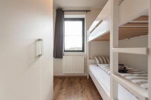 Postel nebo postele na pokoji v ubytování NEW - De sheeper - 10Personen - 5slaapkamers - Sauna - Jacuzzi