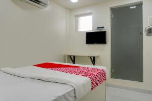 TV a/nebo společenská místnost v ubytování Hotel O B Happy Homely Stay