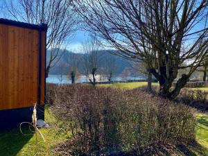 a field with trees and a body of water at Holiday Home Motte by Interhome in Wemding