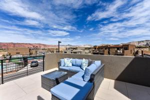 a balcony with a couch and a view of the desert at The View At The Escapes in St. George